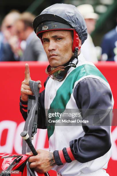 Sick Jockey Michael Walker riding Fanatic returns to scale after winning race 3 the Ladbrokes Sandown Cup during Melbourne Racing at Sandown Lakeside...