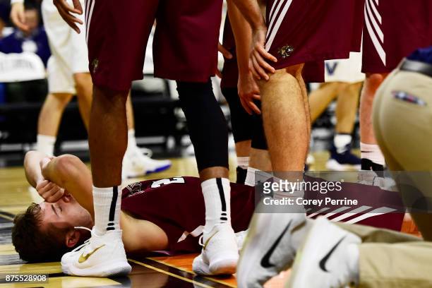 Lukas Jarrett of the Lafayette Leopards lays on the court after a collision with Jermaine Samuels of the Villanova Wildcats during the second half at...
