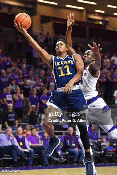 Guard John Edgar Jr. #11 of the California-Irvine Anteaters drives to the basket against the Kansas State Wildcats during the first half on November...