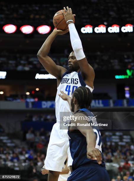 Harrison Barnes of the Dallas Mavericks takes a shot against Andrew Wiggins of the Minnesota Timberwolves at American Airlines Center on November 17,...