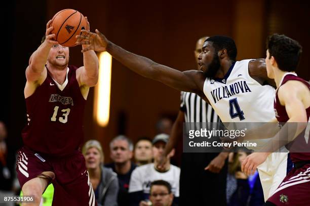 Eric Paschall of the Villanova Wildcats reaches for the ball against Matt Klinewski of the Lafayette Leopards during the second half at the PPL...