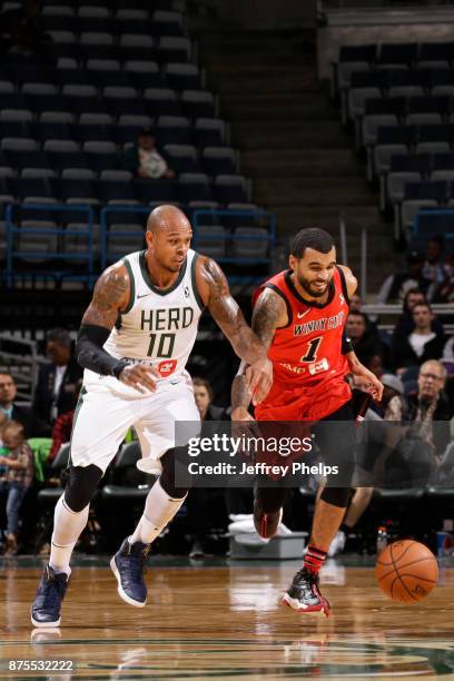 Mychal Mulder of the Windy City Bulls fights for a ball against the Shannon Brown of the Wisconsin Herd in an NBA G-League game on November 17, 2017...