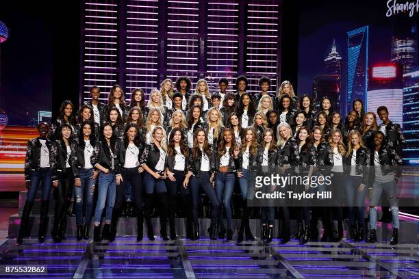 The cast of the 2017 Victoria's Secret Fashion Show pose for their annual group photograph at Mercedes-Benz Arena on November 18, 2017 in Shanghai,...