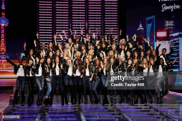 The cast of the 2017 Victoria's Secret Fashion Show pose for their annual group photograph at Mercedes-Benz Arena on November 18, 2017 in Shanghai,...