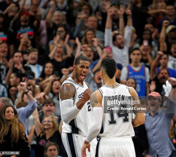 LaMarcus Aldridge of the San Antonio Spurs celebrates with Danny Green of the San Antonio Spurs after they defeated the Oklahoma City Thunder at AT&T...