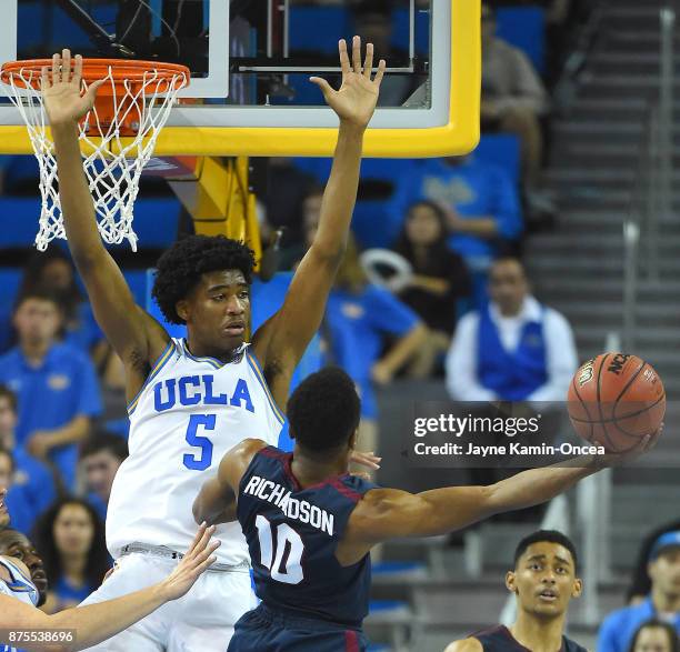 Chris Smith of the UCLA Bruins blocks a shot by James Richardson of the South Carolina State Bulldogs in the second half of the game at Pauley...