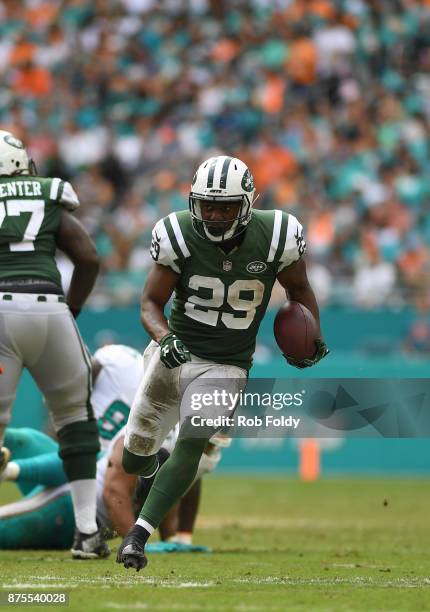 Bilal Powell of the New York Jets carries during the game against the Miami Dolphins at Hard Rock Stadium on October 22, 2017 in Miami Gardens,...