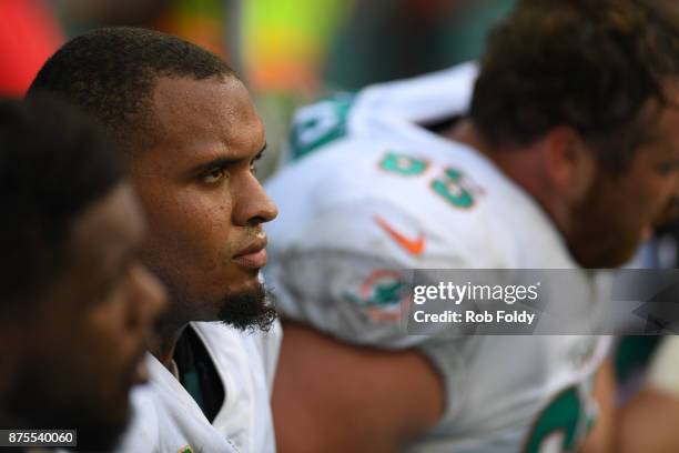 Mike Pouncey of the Miami Dolphins looks on from the sideline during the game against the New York Jets at Hard Rock Stadium on October 22, 2017 in...