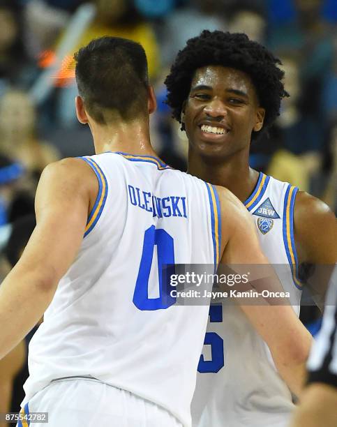 Alex Olesinski of the UCLA Bruins and Chris Smith of the UCLA Bruins celebrate a basket in the second half of the game against the South Carolina...