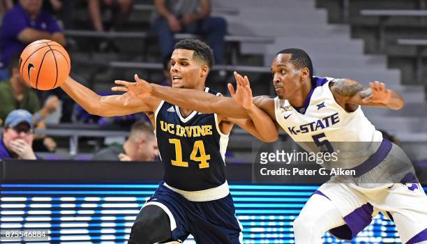 Guard Barry Brown of the Kansas State Wildcats reaches for the ball against guard Evan Leonard of the California-Irvine Anteaters during the second...