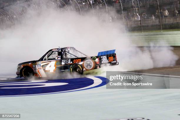 Christopher Bell, driver of the JBL Toyota celebrates winning the Camping World Truck Series Championship at the Ford EcoBoost 200 at Homestead-Miami...