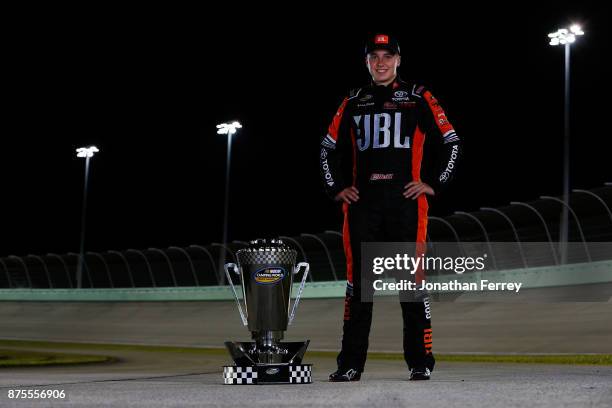 Christopher Bell, driver of the JBL Toyota, poses with the trophy after winning the Camping World Truck Series Championship during the NASCAR Camping...