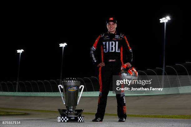 Christopher Bell, driver of the JBL Toyota, poses with the trophy after winning the Camping World Truck Series Championship during the NASCAR Camping...