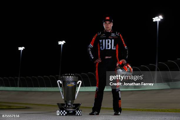 Christopher Bell, driver of the JBL Toyota, poses with the trophy after winning the Camping World Truck Series Championship during the NASCAR Camping...