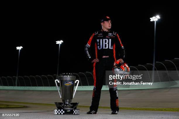 Christopher Bell, driver of the JBL Toyota, poses with the trophy after winning the Camping World Truck Series Championship during the NASCAR Camping...