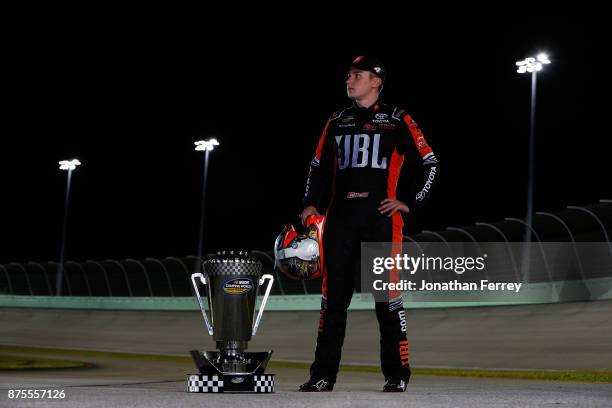 Christopher Bell, driver of the JBL Toyota, poses with the trophy after winning the Camping World Truck Series Championship during the NASCAR Camping...