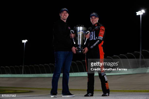 Team owner Kyle Busch and Christopher Bell, driver of the JBL Toyota, poses with the trophy after winning the Camping World Truck Series Championship...