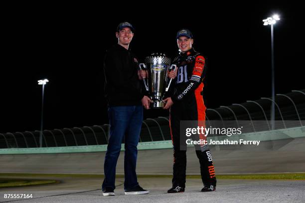 Team owner Kyle Busch and Christopher Bell, driver of the JBL Toyota, poses with the trophy after winning the Camping World Truck Series Championship...