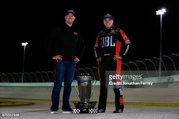 Team owner Kyle Busch and Christopher Bell, driver of the JBL Toyota, poses with the trophy after winning the Camping World Truck Series Championship...