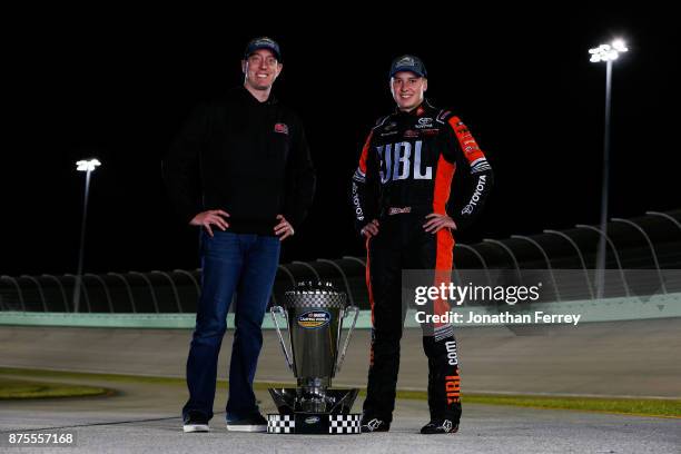 Team owner Kyle Busch and Christopher Bell, driver of the JBL Toyota, poses with the trophy after winning the Camping World Truck Series Championship...