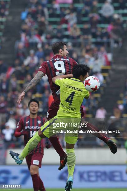 Mike Havenaar of Vissel Kobe and Hiroki Mizumoto of Sanfrecce Hiroshima compete for the ball during the J.League J1 match between Vissel Kobe and...