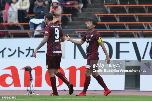 Kazuma Watanabe of Vissel Kobe celebrates scoring hi side's first goal with his team mate Mike Havenaar during the J.League J1 match between Vissel...