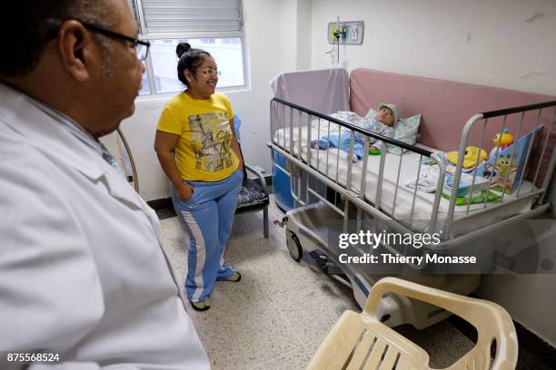 January 3, 2017: The hospital J. M de los Rios. Inside a bedroom. A mother is looking at her child with a Down-Syndrom who will leave the hospital...