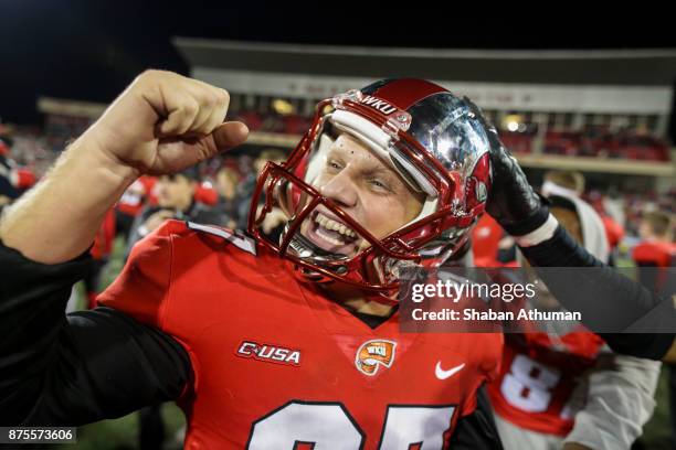 Kicker Ryan Nuss of the Western Kentucky Hilltoppers celebrates with Defensive Back Devon Key after their three overtime win against Middle Tennessee...