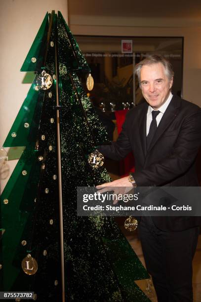 Olivier Lapidus poses with his Chrismas Tree during the 22th Edition Of 'Les Sapins De Noel Des Createurs - Designer's Christmas Trees on November...