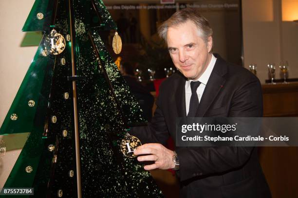 Olivier Lapidus poses with his Chrismas Tree during the 22th Edition Of 'Les Sapins De Noel Des Createurs - Designer's Christmas Trees on November...