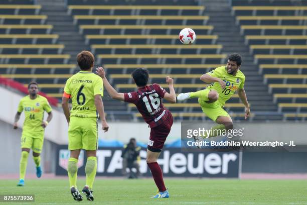 Felipe Silva of Sanfrecce Hiroshima and Hideto Takahashi of Vissel Kobe compete for the ball during the J.League J1 match between Vissel Kobe and...