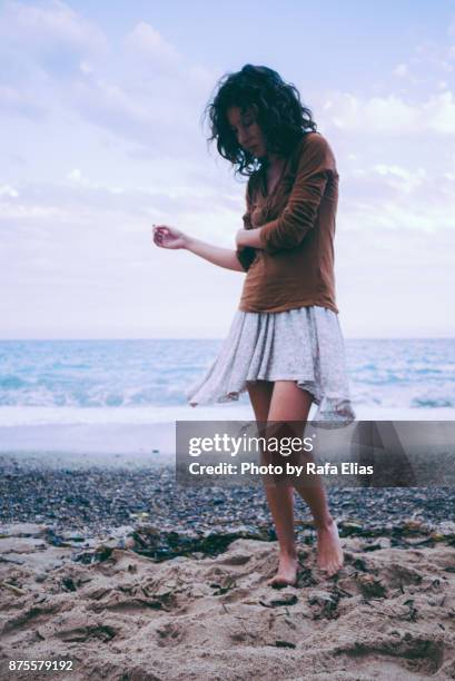 melancholic woman on the beach - coastal deprivation stock pictures, royalty-free photos & images