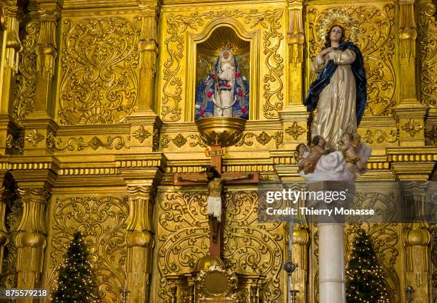 January 4, 2017: Believers pray in the Church Nuestra Senora de Candelaria church on January 4, 2017 in Caracas,Venezuela. The statue of the Christ...