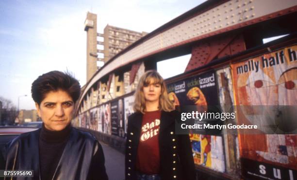 Ana Da Silva and Gina Birch of the Raincoats, portrait on a railway bridge with Trellick Tower in the background, west London 1997.
