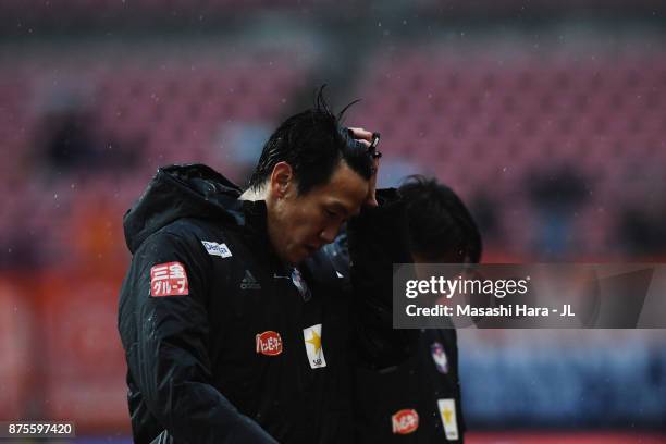 Kisho Yano of Albirex Niigata shows dejection after his team's relegation to the J2 despite their 1-0 victory in the J.League J1 match between...