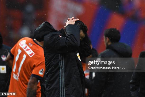 Kisho Yano of Albirex Niigata shows dejection after his team's relegation to the J2 despite their 1-0 victory in the J.League J1 match between...