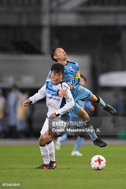 Yasuyuki Konno of Gamba Osaka and Yu Kobayashi of Kawasaki Frontale compete for the ball during the J.League J1 match between Kawasaki Frontale and...