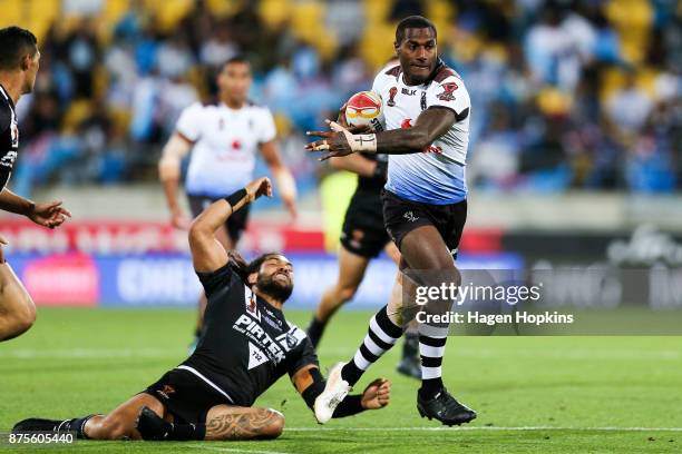 Suliasi Vunivalu of Fiji breaks the tackle of Adam Blair of the Kiwis during the 2017 Rugby League World Cup Quarter Final match between New Zealand...