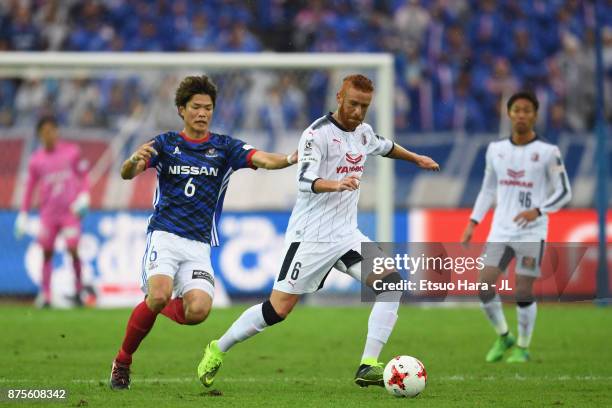 Souza of Cerezo Osaka controls the ball under pressure of Takahiro Ogihara of Yokohama F.Marinos during the J.League J1 match between Yokohama...