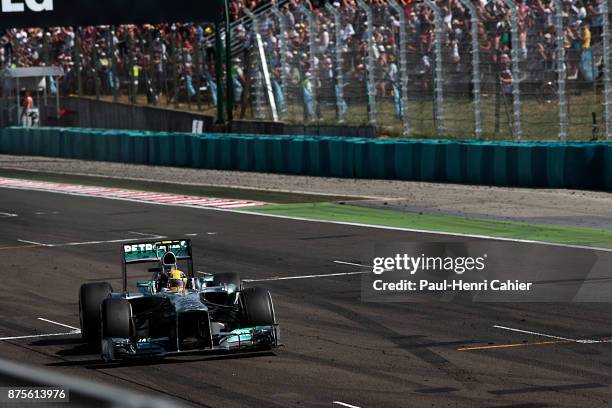 Lewis Hamilton, Mercedes F1 W04, Grand Prix of Hungary, Hungaroring, 28 July 2013. Lewis Hamilton crosses the finish line and raises his hand after...