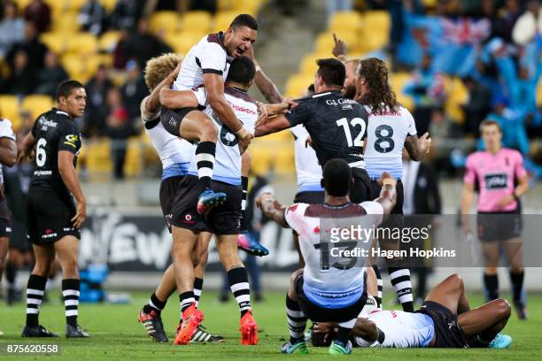 Marcelo Montoya and Jarryd Hayne of Fiji celebrate the win at the final whistle during the 2017 Rugby League World Cup Quarter Final match between...