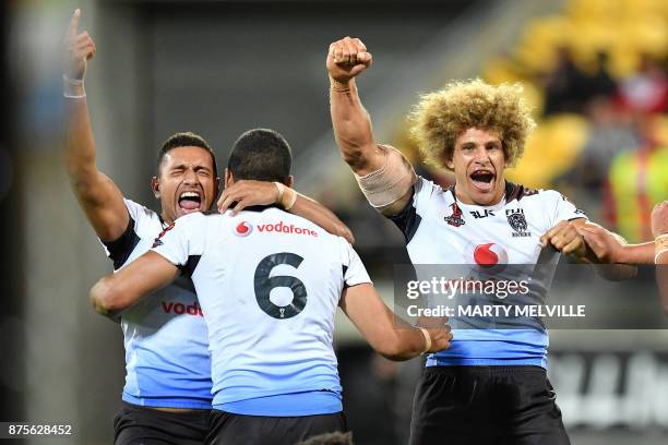 Fiji's Marcelo Montoya , Jarryd Hayne and Eloni Vunakece celebrate their win during the Rugby League World Cup quarter-final match between New...