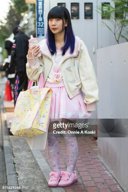 Hiromin , wearing a Milkman denim bomber white and pink jacket, Miracle_on pink skirt with pink stars and white stripe, Puma pink shoes with pink...