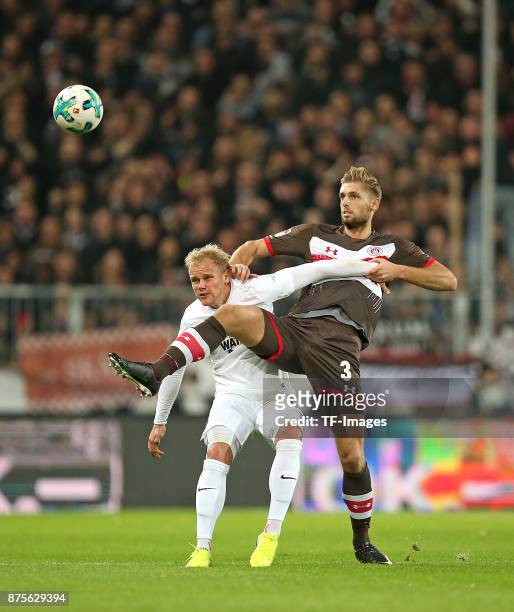 Soeren Bertram of Aue and Lasse Sobiech of Pauli battle for the ball during the Second Bundesliga match between FC St. Pauli and FC Erzgebirge Aue at...
