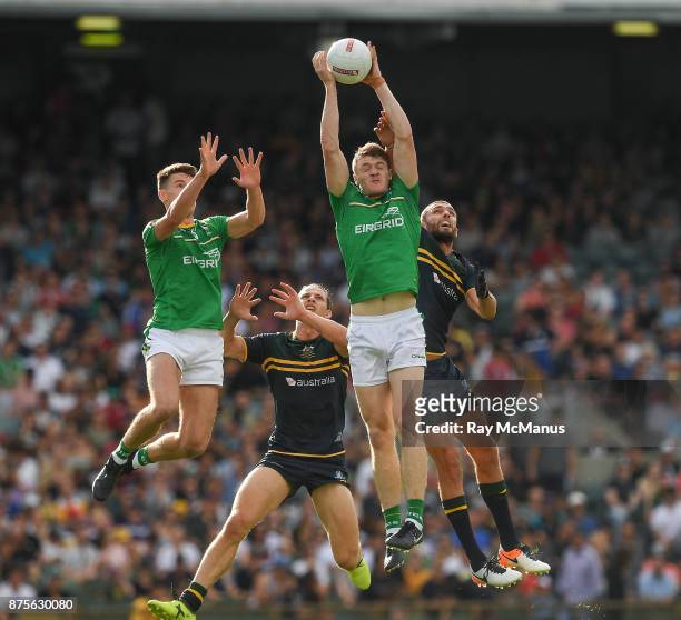 Perth , Australia - 18 November 2017; Kevin Feely of Ireland wins the ball from teammate Niall Grimley and Nat Fyfe and Rory Laird of Australia...