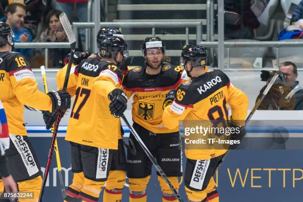 Brent Raedeke of Germany celebrates after scoring his team`s second goal with Marcus Kink of Germany and Daniel Pietta of Germany during the...