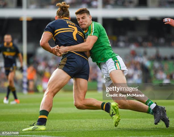 Perth , Australia - 18 November 2017; Nat Fyfe of Australia is tackled by Niall Grimley of Ireland during the Virgin Australia International Rules...