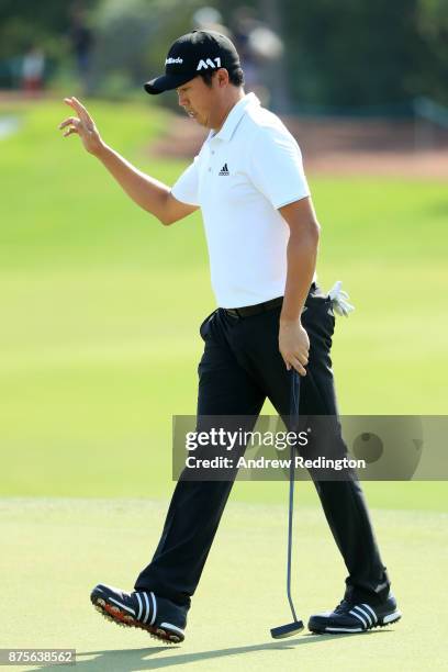 David Lipsky of the United States acknowledges the crowd on the 18th hole during the third round of the DP World Tour Championship at Jumeirah Golf...