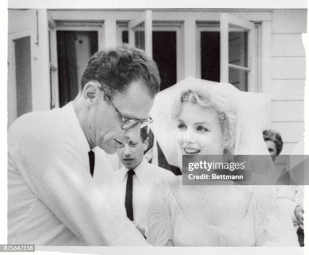 Roxbury, CT-, Playwright Arthur Miller and his bride, Marilyn Monroe are shown after their marriage in a religious ceremony at the home of Mr.and...