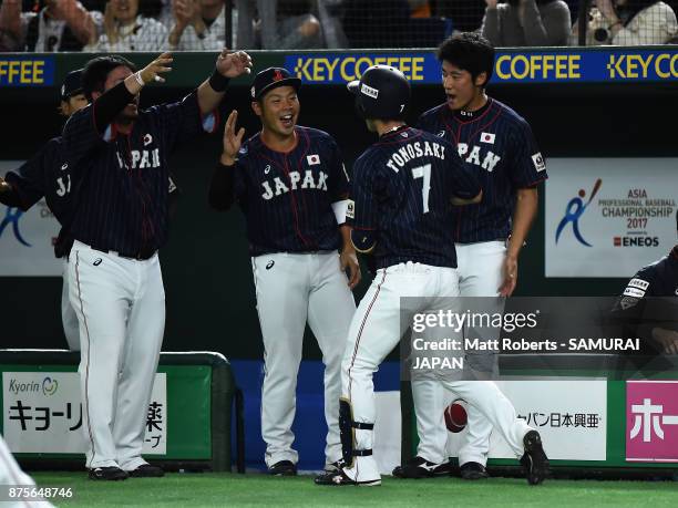 Infielder Shuta Tonosaki of Japan celebrates with his team mates after hitting a solo homer in the top of second inning during the Eneos Asia...